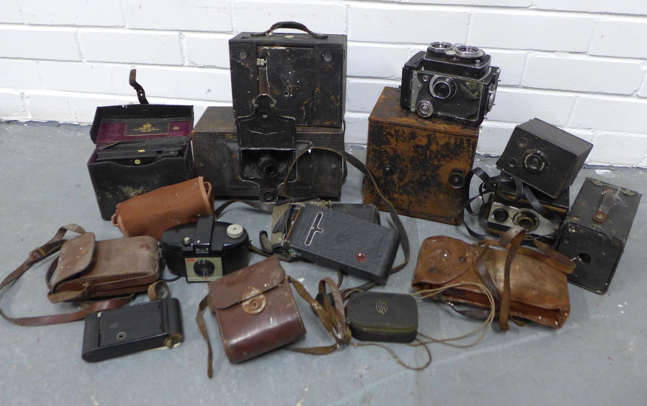 Box containing a quantity of vintage cameras