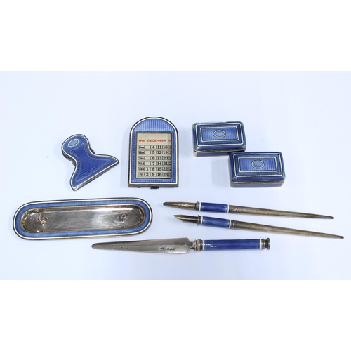 50 - An Edwardian silver and guilloche enamel desk set, comprising seventeen items to include a spring ba... 