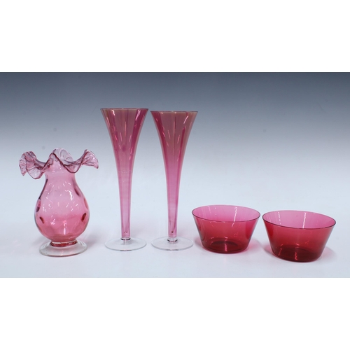 125 - Pair of modern cranberry glass vases, 24cm, together with an earlier  frilled edge cranberry glass v... 