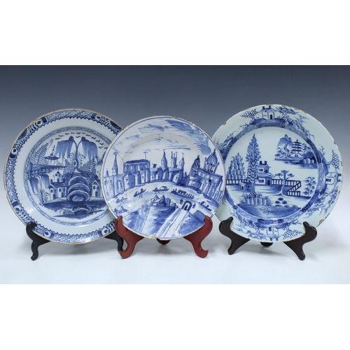 136 - Two large 18th century Delft blue and white tin glazed chargers / plates, together with a smaller ti... 