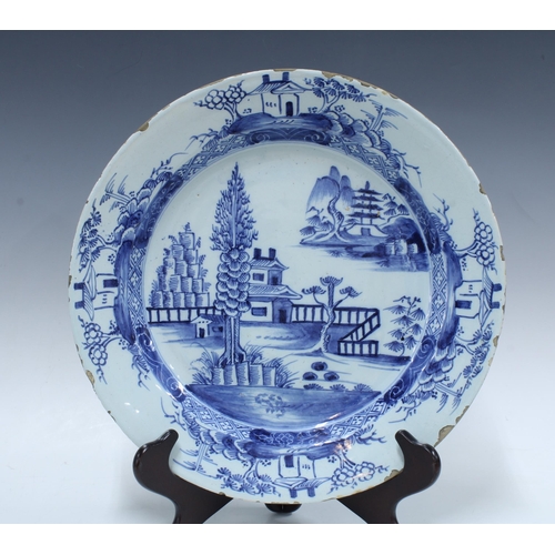 136 - Two large 18th century Delft blue and white tin glazed chargers / plates, together with a smaller ti... 
