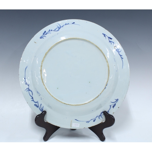 136 - Two large 18th century Delft blue and white tin glazed chargers / plates, together with a smaller ti... 