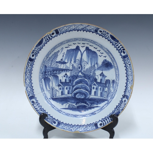 136 - Two large 18th century Delft blue and white tin glazed chargers / plates, together with a smaller ti... 