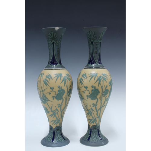 145 - Pair of early 20th century Villeroy & Boch Mettlach vases, each relief decorated with tropical birds... 