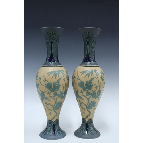 145 - Pair of early 20th century Villeroy & Boch Mettlach vases, each relief decorated with tropical birds... 
