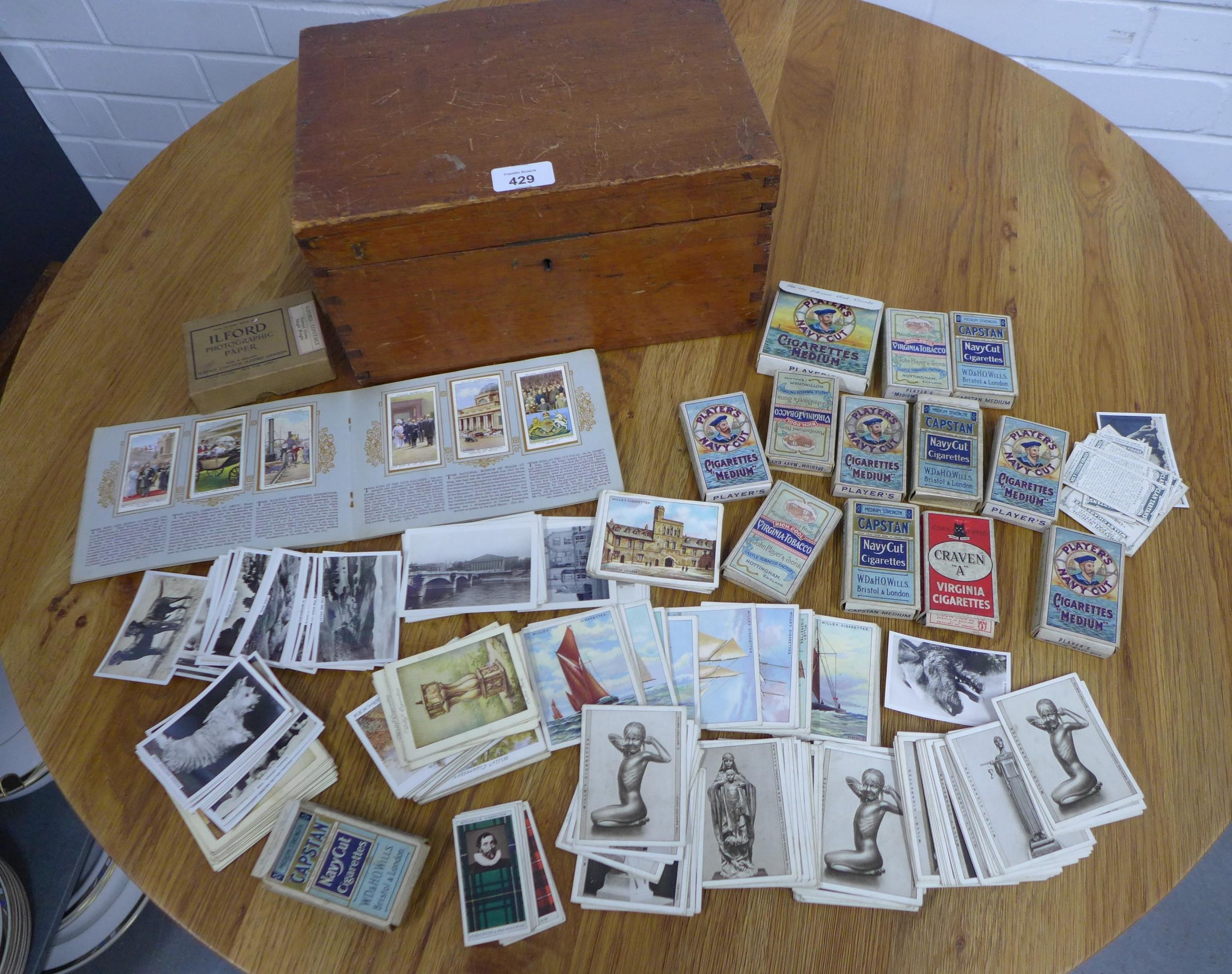 Wooden box containing vintage cigarette cards, etc,