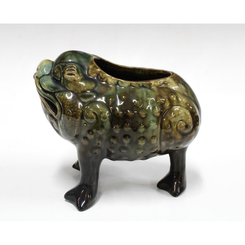 19th century pottery spoon warmer in the form of a grotesque three ...