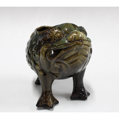 19th century pottery spoon warmer in the form of a grotesque three ...