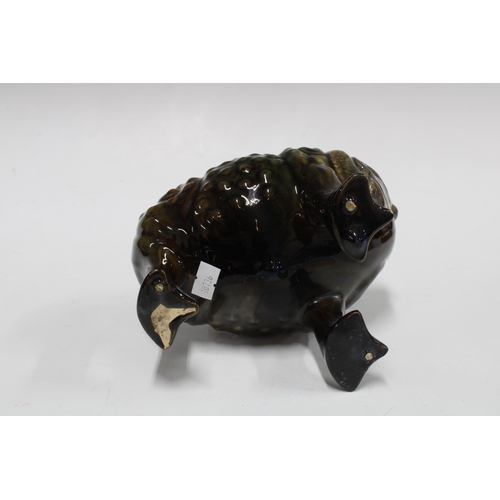 19th century pottery spoon warmer in the form of a grotesque three ...