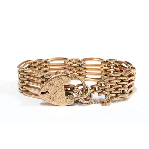 13 - 9ct rose gold gatelink bracelet with an engraved 9ct gold heart shaped padlock, hallmarks for Sheffi... 