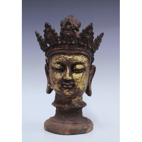 337 - Cast iron and composite filled buddha head, gilt decorated with downward gaze with socle base, 37cm ... 
