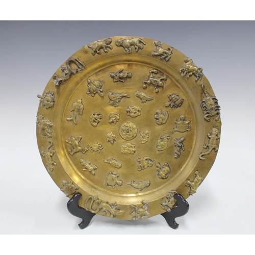 344 - Brass tripod footed tray relief decorated with animals, 33cm, together with a copper pierced floral ... 