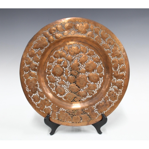 344 - Brass tripod footed tray relief decorated with animals, 33cm, together with a copper pierced floral ... 