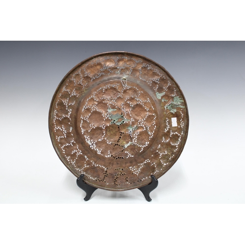 344 - Brass tripod footed tray relief decorated with animals, 33cm, together with a copper pierced floral ... 