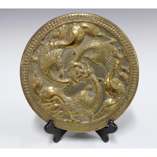 344 - Brass tripod footed tray relief decorated with animals, 33cm, together with a copper pierced floral ... 
