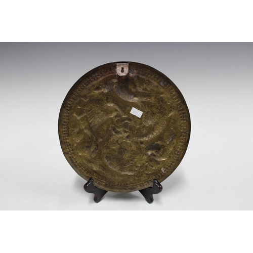 344 - Brass tripod footed tray relief decorated with animals, 33cm, together with a copper pierced floral ... 