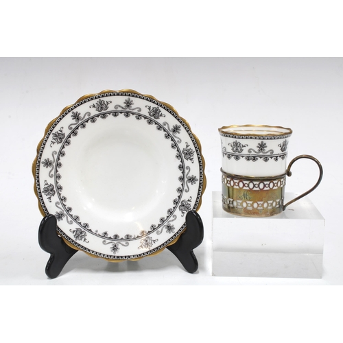 64 - A set of six hallmarked silver coffee can holders with Aynsley black and white cups and saucers, Bir... 