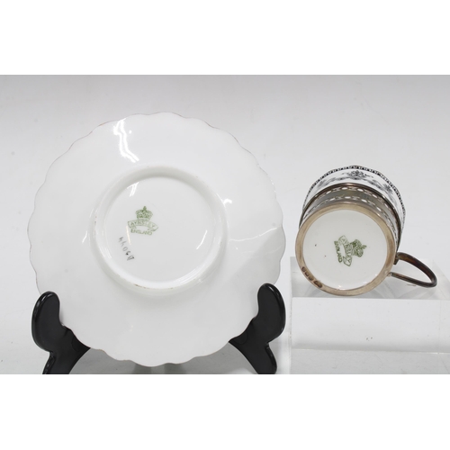 64 - A set of six hallmarked silver coffee can holders with Aynsley black and white cups and saucers, Bir... 