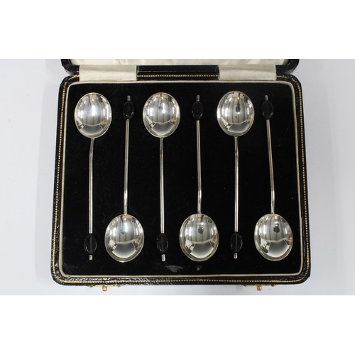 66 - A set of six silver coffee bean handled spoons, in fitted a fitted case (6)