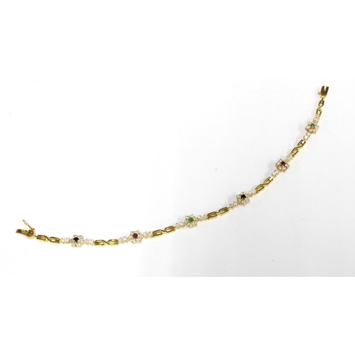 78 - Tennis style bracelet with paste set flowerheads, set in yellow metal with ins=distinct marks on cla... 