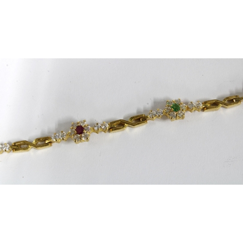 78 - Tennis style bracelet with paste set flowerheads, set in yellow metal with ins=distinct marks on cla... 