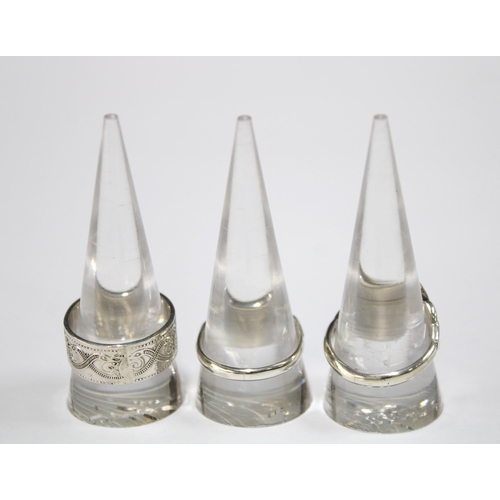 100F - A silver celtic ring by Gordon H. Walker, Edinburgh 2007 together with another hallmarked for 208 an... 