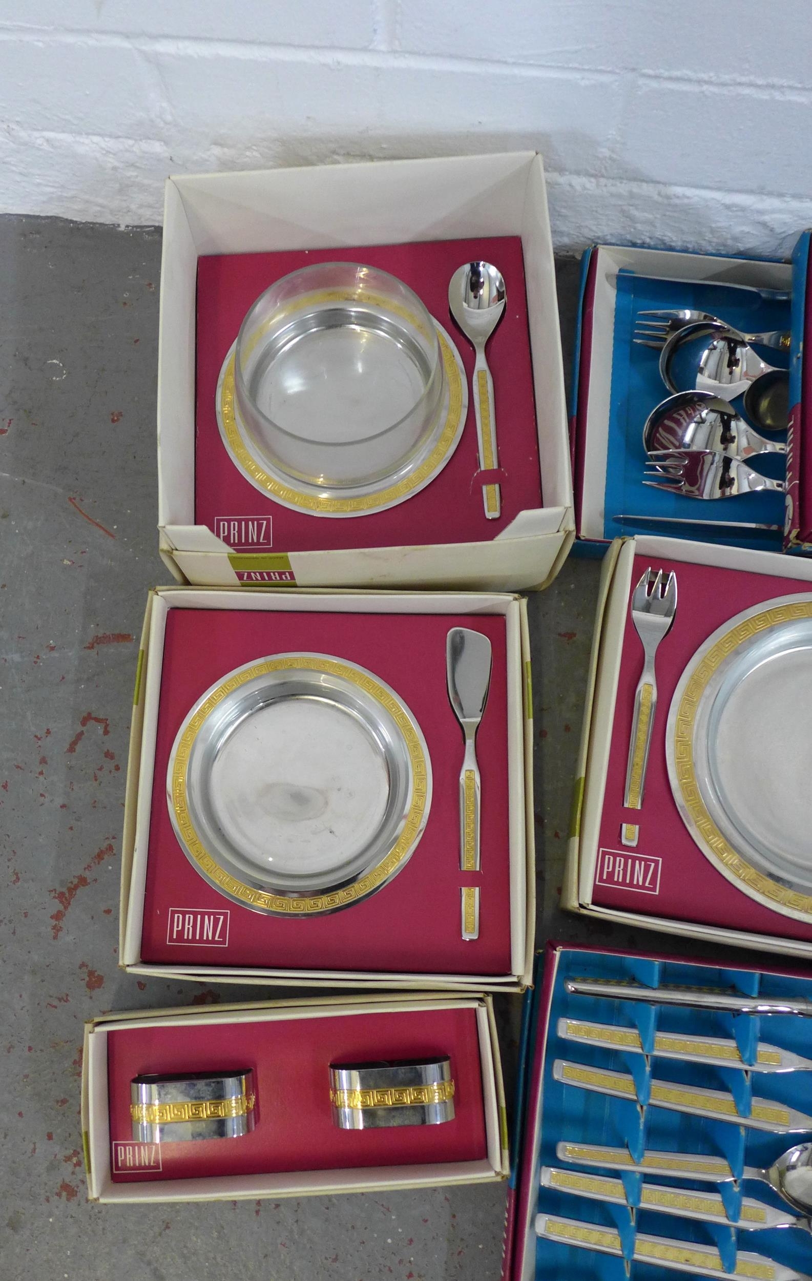 A large collection of Prinz vintage cutlery and serving pieces, in ...