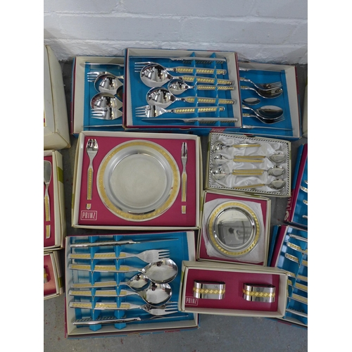 A large collection of Prinz vintage cutlery and serving pieces, in ...