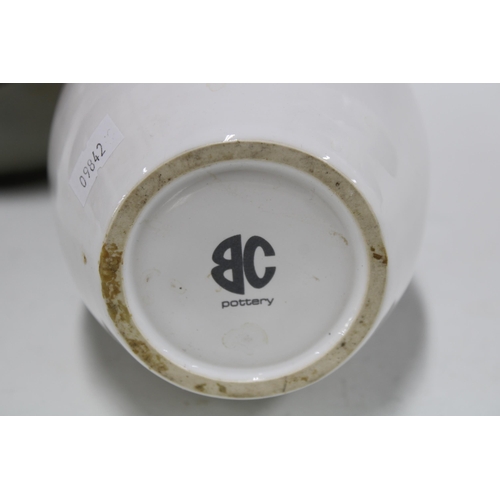 446 - Three studio pottery vases to include a large vase of slender proportions, a white glazed Brannam ba... 