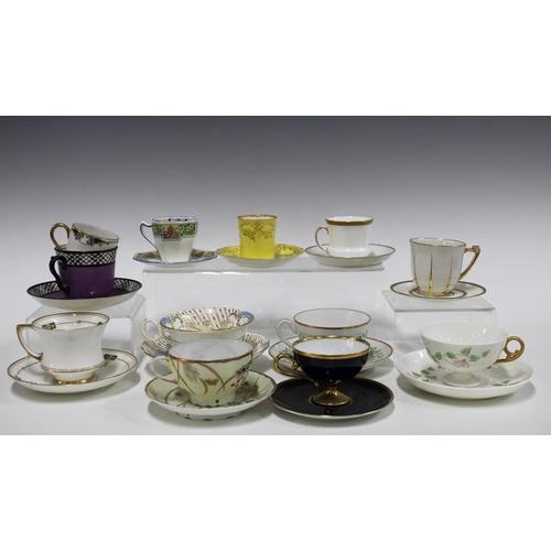 448 - A collection of porcelain and bone china cups and saucers