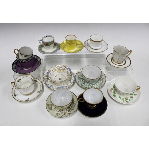448 - A collection of porcelain and bone china cups and saucers