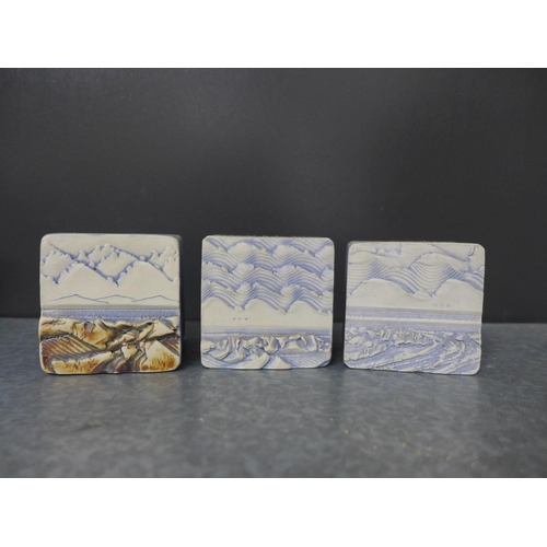 451 - Duncan Hood Dunnydeer studio pottery landscape and sea textured vases, tallest 12cm, together with t... 