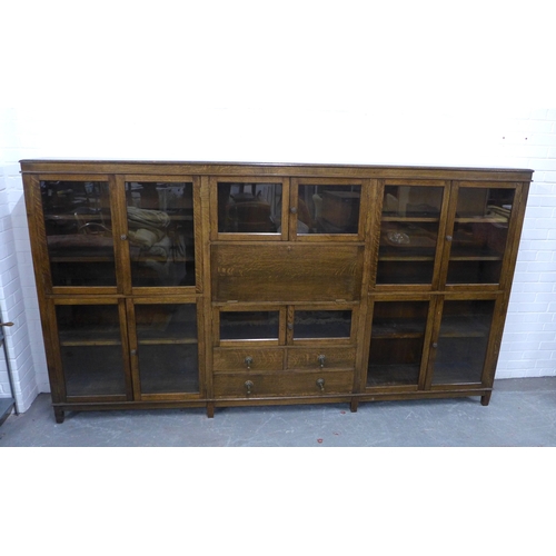 300 - An early 20th century oak glazed secretaire cabinet, 178 x 153 x 34cm.