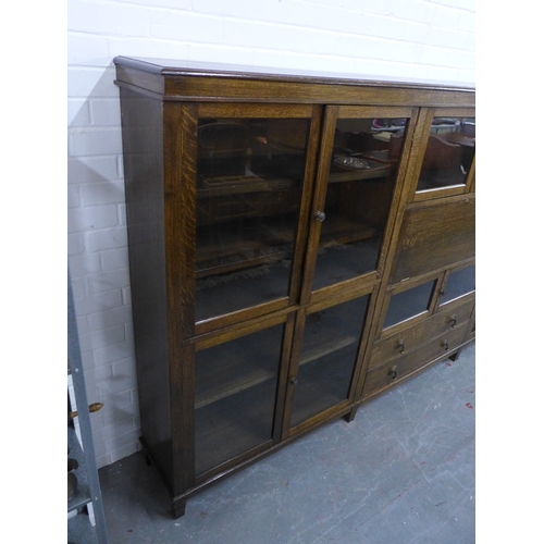 300 - An early 20th century oak glazed secretaire cabinet, 178 x 153 x 34cm.