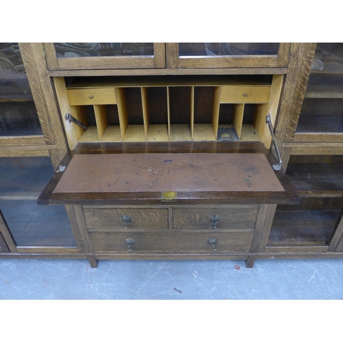 300 - An early 20th century oak glazed secretaire cabinet, 178 x 153 x 34cm.