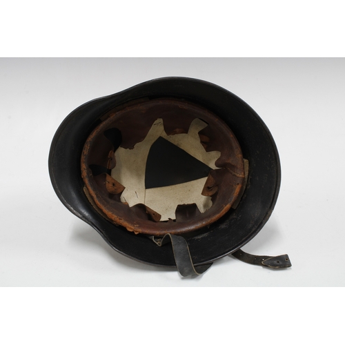 401 - German WWII steel helmet in black, with National Shield decal to one side and an indistinct decal to... 