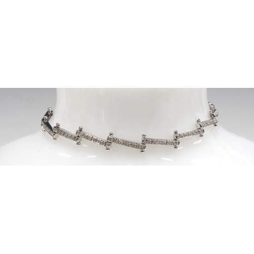 6 - An 18ct white gold diamond set bracelet, stamped 750 & 18k,