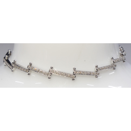 6 - An 18ct white gold diamond set bracelet, stamped 750 & 18k,