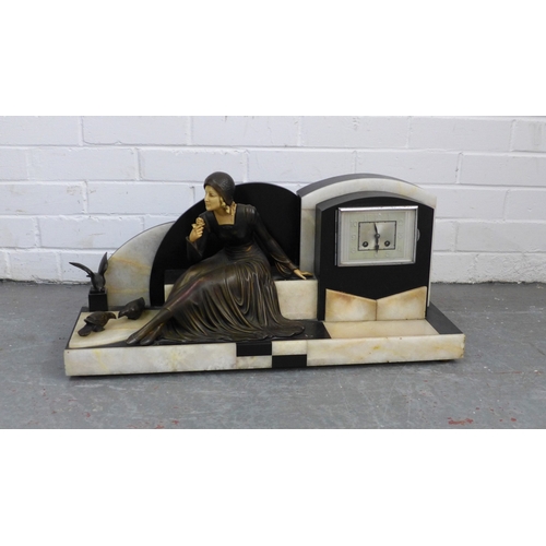 A large French Art Deco mantel clock, the rectangular dial on a stepped ...