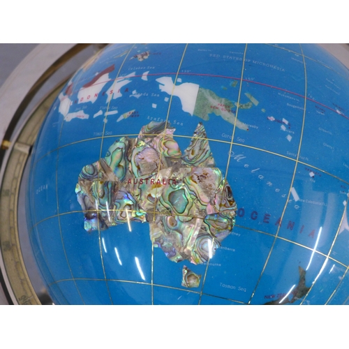 Decorative, rotating world globe featuring inlaid semi precious ...