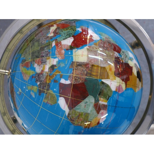 Decorative, rotating world globe featuring inlaid semi precious ...