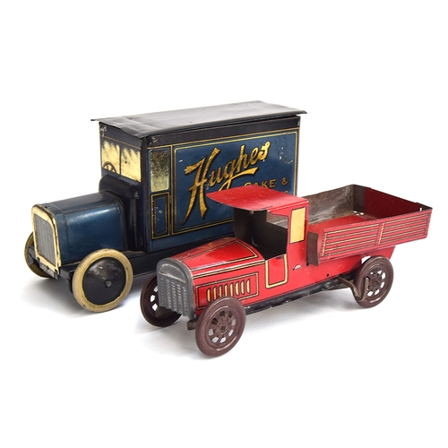 418 - An early tinplate clockwork flatbed lorry, red with yellow trim, in good condition, 18cmL, together ...