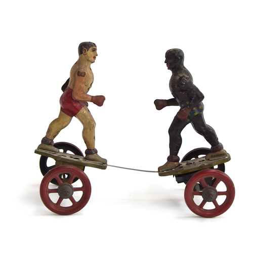 421 - A Gebruder Einfalt, Germany, tinplate clockwork boxing figures on four spoked wheels, the two tinpla...