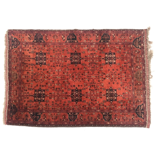 664 - A small red ground West Persian rug, 130x193cm