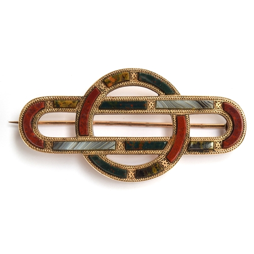 28 - A Scottish brooch set with agates, 5.75cm, tests as 9ct