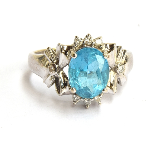 7 - A 9ct gold white gold dress ring set with a blue stone and small diamonds, gross weight 2.9g, size K