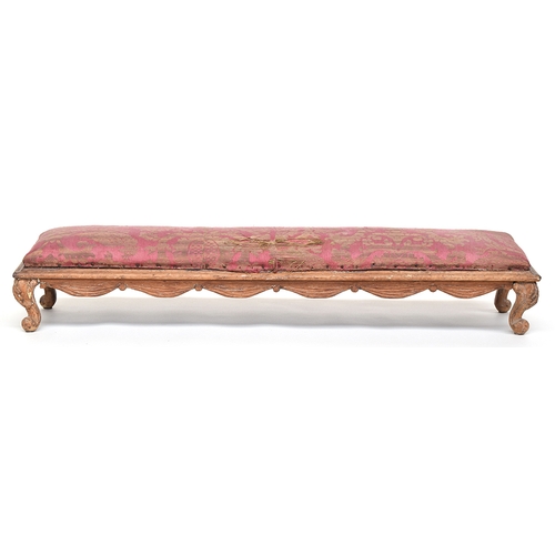 638 - A Louis XVI style fruitwood long upholstered footstool, with swag frieze, on short carved cabriole l... 