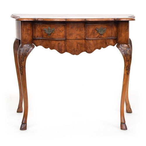 641 - A 19th century Dutch burr elm veneered side table, the shaped front with two frieze drawers above a ... 