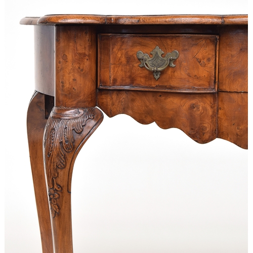 641 - A 19th century Dutch burr elm veneered side table, the shaped front with two frieze drawers above a ... 