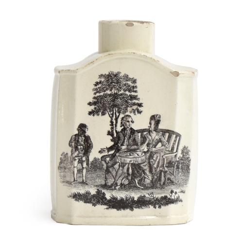 347 - An 18th century Wedgwood creamware tea canister, of swept shouldered form, printed in black with The... 